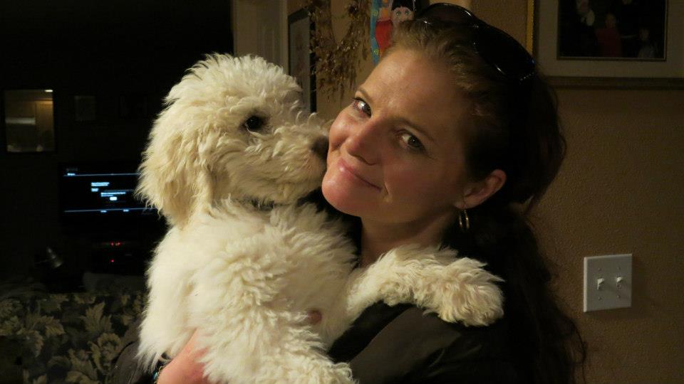 Me holding our standard poodle puppy "Pele"!