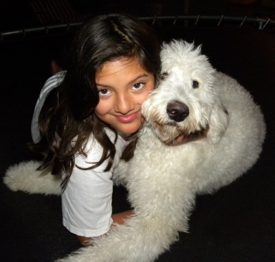 My daughter and English Goldendoodle Baby on the Trampoline at night...